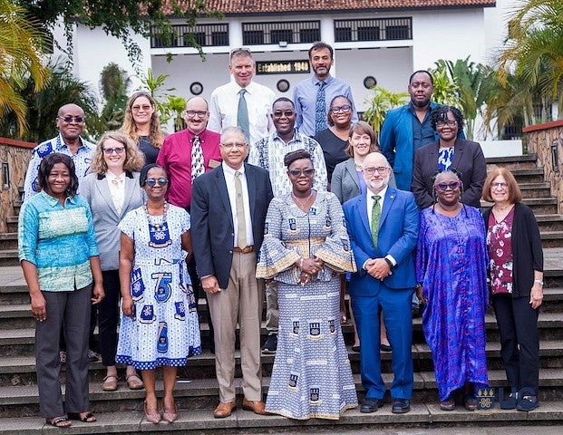 Group of UO and University of Ghana faculty standing for a photot