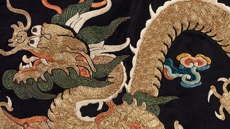 Woven Chinese textile featuring a beige colored dragon